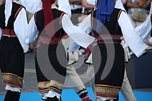 Balkan folk dance performance by a costumed group
