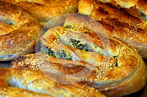 Balkans pastry borek on display in a bakery photo