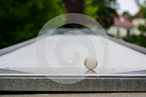 Ball as close-up shot on a miniature golf course, copy space, selected focus