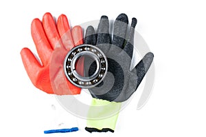 Ball bearing and gloves isolated on white background.Copy space