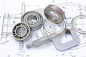 Ball bearings with micrometer on technical drawing