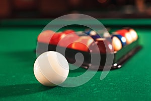 Ball and chalk on the billiard table.