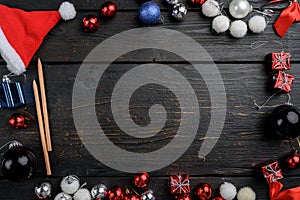 Ball for the Christmas tree, frame, top view flat lay, on black wooden table background, with copy space for text