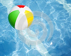 Ball floating in a blue swimming pool