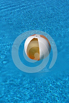 Ball floating in blue water
