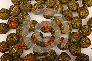 A ball of flower tea on a white background. Close up