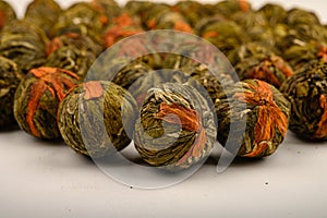 A ball of flower tea on a white background. Close up