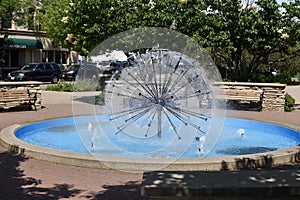 Ball-fountain surrounded by greenery in a park under sunlight in Naperville in Illinois photo