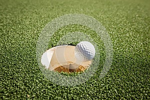 A picture showing a hole in one.