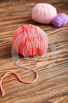 Ball of knitting yarn on wooden table