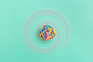 Ball or knot of thin multicolored elastic band rubbers . Tangle of thoughts