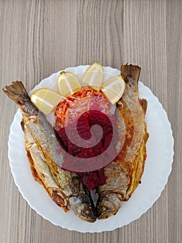 Fish on a plate for lunch - healthy meal photo