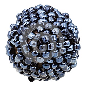 Ball from many sewn black glass beads close up