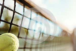 Ball in net closeup, big tennis concept