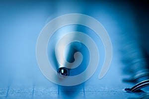 Ball point pen on spiral note pad.,close up