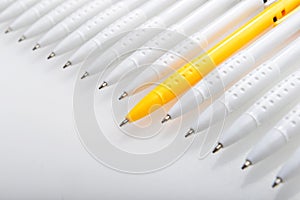 Ball point pens are arranged on white background