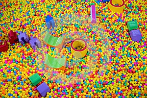 Ball pool in the children`s playroom. colorful plastic balls on children`s playground.