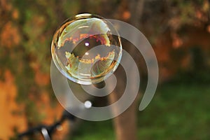 Ball-shaped colored soap bubble