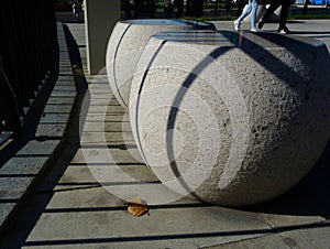 Ball shaped precast concrete seats with strong texture and shadows