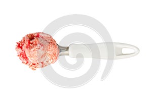 Ball of strawberry ice cream with jam in scoop