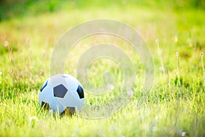 A ball for street soccer football under the sunset ray light