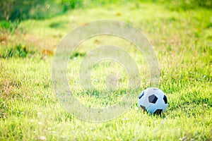 A ball for street soccer football under the sunset ray light