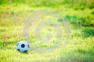 A ball for street soccer football under the sunset ray light