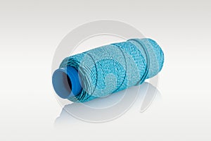 ball of thread, spool of sewing thread and needle isolated on white background