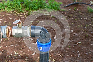 ball valve and plastic pipe on an irrigation field in the village 3
