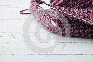 Ball of wool yarn and knitting needles