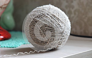 A ball of woolen threads on the table