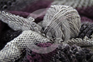 Ball of yarn on knitted fabric