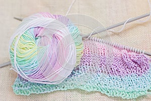 Ball of yarn with knitting needles