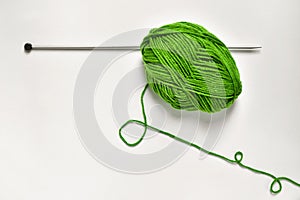 Ball of yarn and knitting pin
