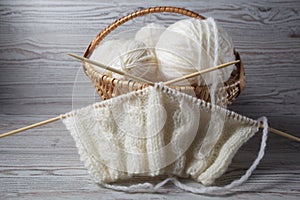 Ball of yarn and knitting on a table