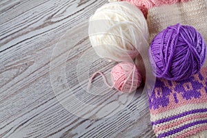 Ball of yarn and knitting on a table