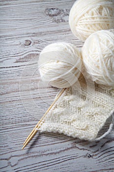 Ball of yarn and knitting on a table