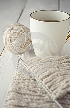 Ball of yarn and knitting on a table