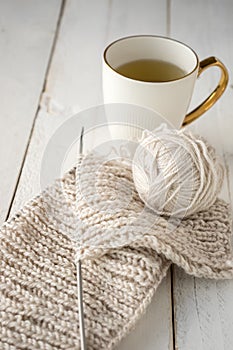 Ball of yarn and knitting on a table