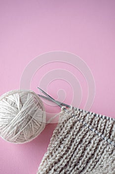 Ball of yarn and knitting on a table