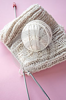 Ball of yarn and knitting on a table