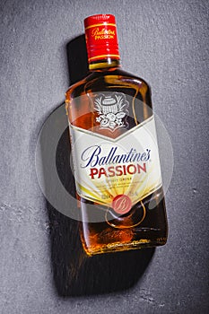 Ballantines passion spirit drink on stone slate background.