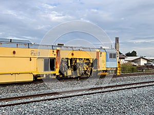 The ballast tamping machine for maintaining the railroad ties and ballast stone.