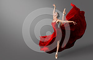 Ballerina Dance. Ballet Dancer in Red Dress jumping Spit. Woman in Ballerina Shoes dancing in Evening Silk Gown flying on Wind