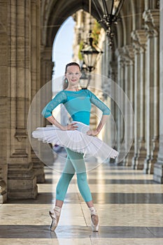 Young dancer with tutu and turqoise trikot photo