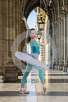 Young dancer with tutu and turqoise trikot photo