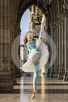 Young dancer with tutu and turqoise trikot photo