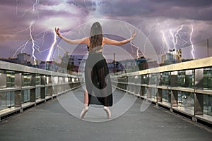 Ballerina dances on the bridge