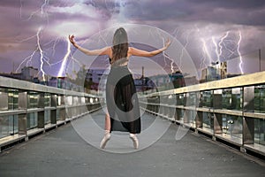 Ballerina dances on the bridge photo