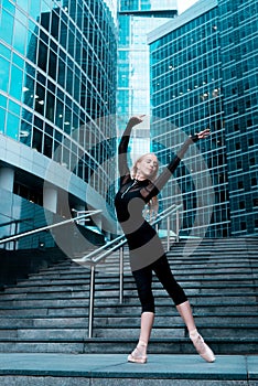 Ballerina dancing on the city street